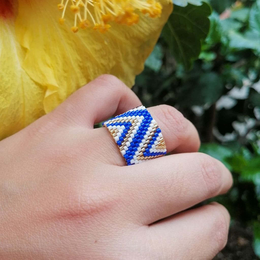 Anillo azul blanco y dorado